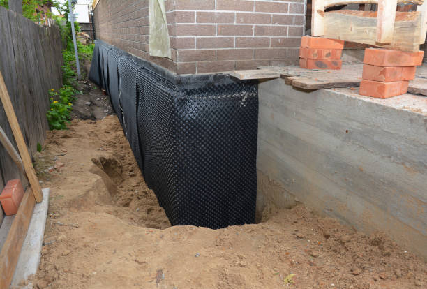Happy homeowners after waterproofing job in Cicero